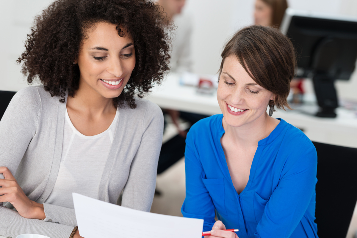 Business Academy. Two ladies learning