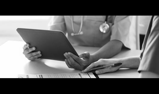Business Solutions. Veterinarian reviewing MWI Animal Health Practice Management Technology Software